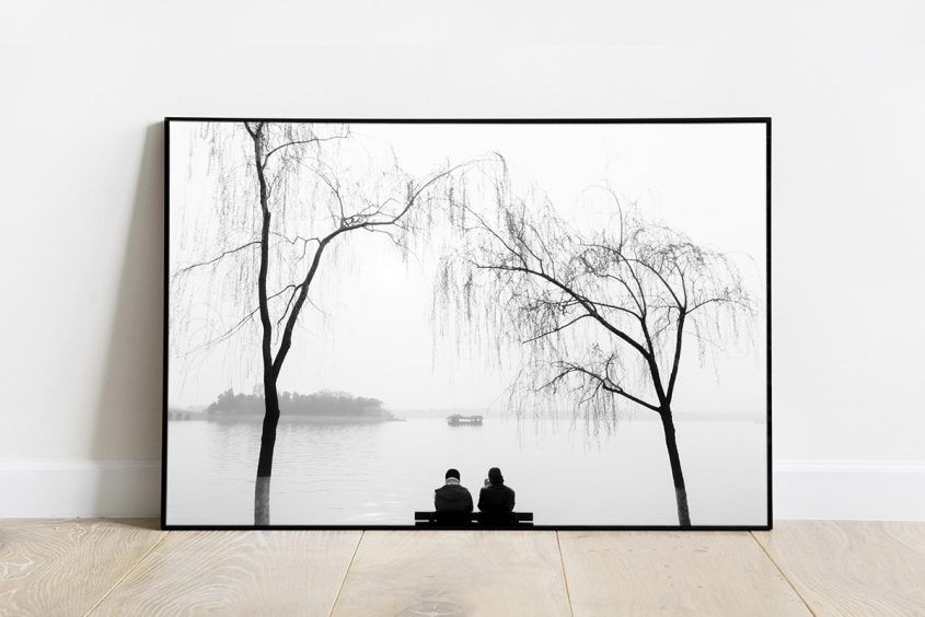 Black and white print of a couple contemplating the views of Kunming Lake, near The Summer Palace, in Beijing