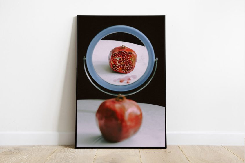 Print of an open pomegranate-in front of mirror, conceptual art